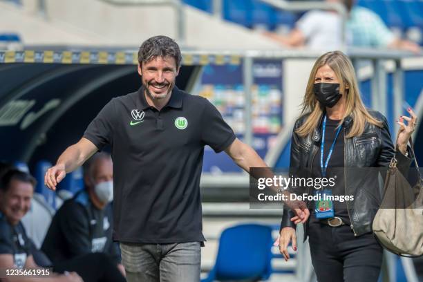 Head coach Mark van Bommel of VfL Wolfsburg laughs prior to the Bundesliga match between TSG Hoffenheim and VfL Wolfsburg at PreZero Arena on...