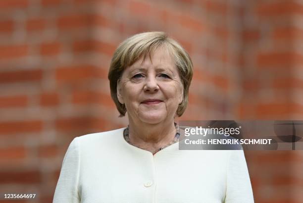 German Chancellor Angela Merkel poses for a photo prior an ecumenical service on the Day of German Unity at the Saint Paul's Church in Halle, eastern...