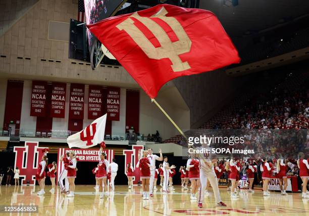 Indiana University cheerleaders pump up the crowd during Hoosier Hysteria at Simon Skjodt Assembly Hall.