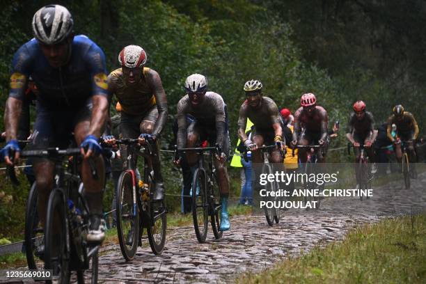 The pack rides during the 118th edition of the Paris-Roubaix one-day classic cycling race, between Compiegne and Roubaix, northern France, on October...