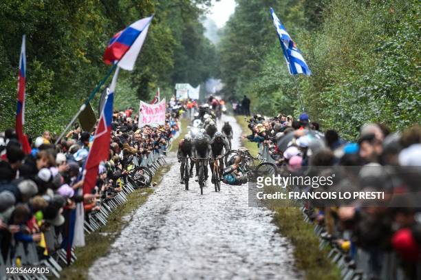 Competitors falls during the 118th edition of the Paris-Roubaix one-day classic cycling race, between Compiegne and Roubaix, northern France, on...
