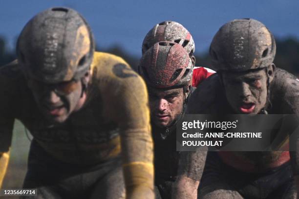 The pack rides during the 118th edition of the Paris-Roubaix one-day classic cycling race, between Compiegne and Roubaix, northern France, on October...