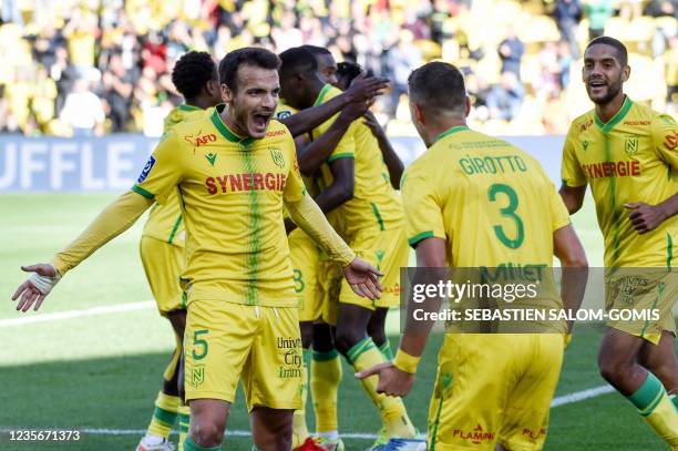 Nantes' Spanish midfielder Pedro Chirivella celebrates after scoring a goal with Nantes' Brazilian defender Andrei Girotto during the French L1...