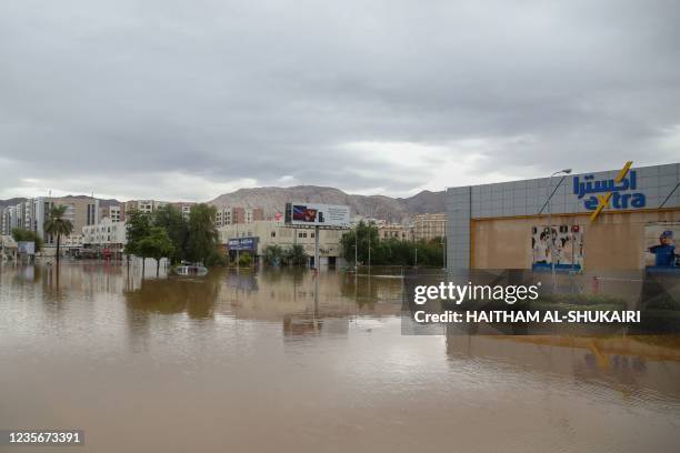 General view shows a flooded street amid cyclone Shaheen in Oman's capital Muscat on October 3, 2021. - Nine people were found dead in Oman and Iran...