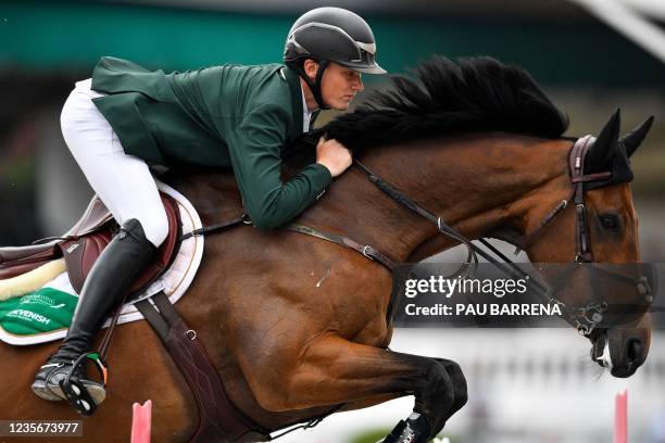 Ireland's Michael Duffy rides his horse Zilton SL Z as they compete in the Longines FEI Jumping Nations Cup Final at the Olympic arena of the Real...