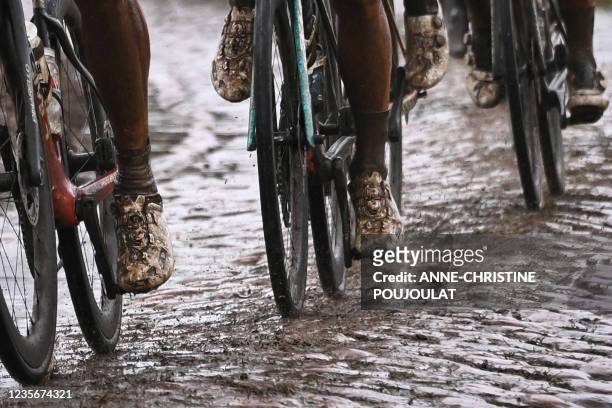 Riders compete in the 118th edition of the Paris-Roubaix one-day classic cycling race, between Compiegne and Roubaix, northern France, on October 3,...