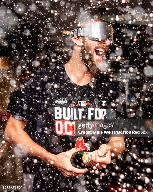 Chris Sale of the Boston Red Sox celebrates with champagne after clinching the American League Wild Card top seed after a game against the Washington...