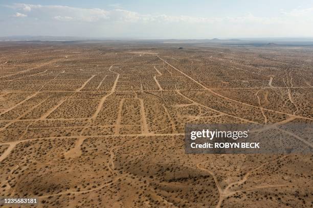In this aerial picture taken on September 25, 2021 a vast network of roads cut in the Mojave Desert, intended for a massive suburban paradise that...