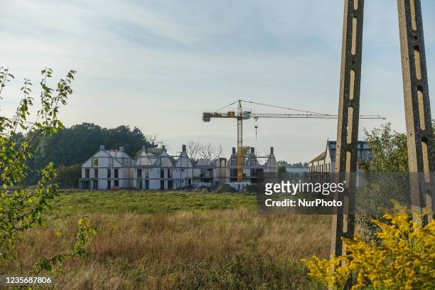 New new housing estate construction site in a field on the outskirts of the city is seen in Gdansk, Poland on 3 October 2021 Rapid rise in house...