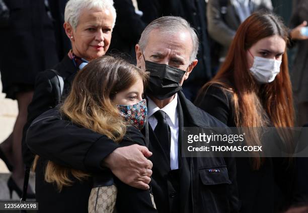 French actor Francis Huster and his daughter Elisa Huster leave the funeral ceremony dedicated to Francois Florent, founder and general director of...