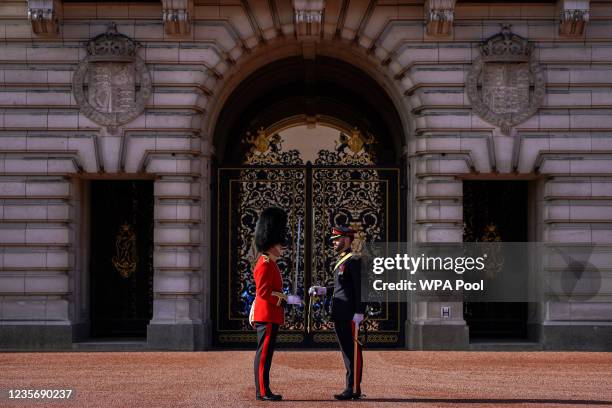 Soldier from the 1st Battalion Coldstream Guards and a solider from the 1st Regiment Royal Canadian Horse Artillery take part in the Changing of the...