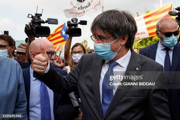 Catalonia's exiled former leader Carles Puigdemont leaves on October 4, 2021 the Sassari courthouse in Sardinia, Italy, after attending his...