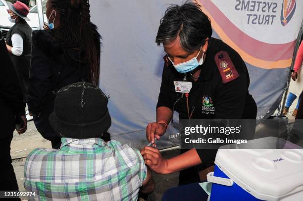 Nurse administers vaccine to elderly man during Vooma Vaccination Campaign on October 03, 2021 in Durban, South Africa. This is part of the...