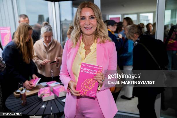 Former Danish prime minister Helle Thorning-Schmidt poses with her book 'Blondinens betragtninger' - The Blonde's Considerations - during the book's...