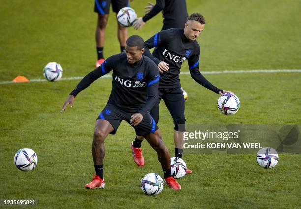 Netherland national football team's Georginio Wijnaldum and Noa Lang attend a training session at the KNVB Campus in Zeist on October 4, 2021. - The...