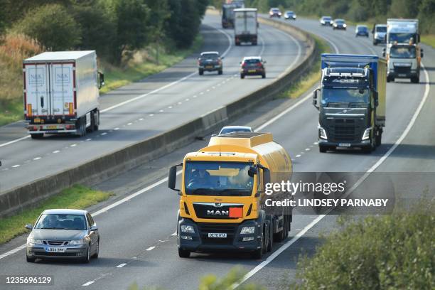 Fuel tanker drivers drives their lorry along the M180 motorway near the Prax Lindsey Oil Terminal in North Killingholme, north east England on...