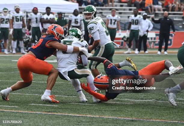 Illinois defensive back Sydney Brown stops Charlotterunning back Calvin Camp with help from Illinois defensive back Jartavius Martin during a college...