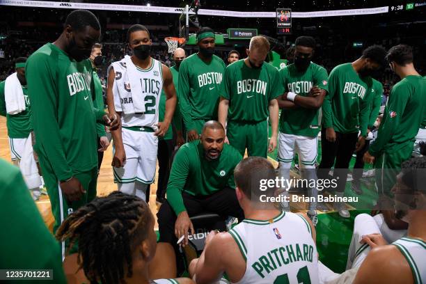 Head Coach Ime Udoka of the Boston Celtics huddles with the team during the game against the Orlando Magic on October 4, 2021 at the TD Garden in...