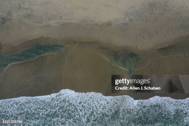 Huntington Beach, CA Oil spill cleanup at on Monday, Oct. 4, 2021 in Huntington Beach, CA. Rews raced Sunday morning to contain the damage from a...