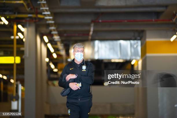 Logistic member of the security of Brazil's national football team is seen as members of the Brazil federation of football team board their bus at...