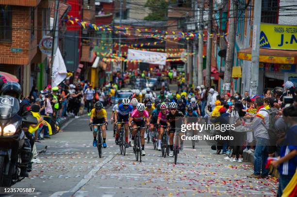 People of La Perseverancia neighborhood support cyclists during the last stage finals of the Vuelta a Colombia Femenina 2021 in Bogotá, Colombia,...