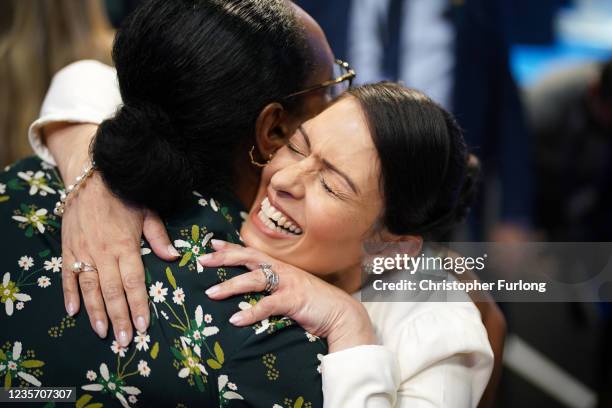 Home Secretary Priti Patel embraces Nimco Ali, co-founder and CEO of The Five Foundation, after delivering her keynote speech on day three of the...