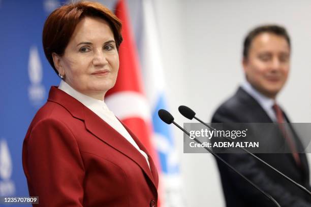 Leader of the Good Party Meral Aksener , flanked by leader of the Democracy and Progress Party Ali Babacan , looks on, as they give a press...