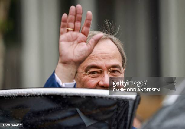 Leader of Germany's conservative Christian Democratic Union and CDU/CSU party union candidate for chancellor Armin Laschet waves as he leaves after...