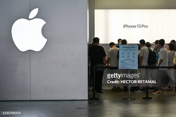 People visit an Apple store in Shanghai on October 5, 2021.