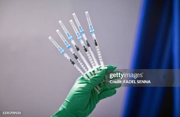 Moroccan health shows syringes of the Pfizer-BioNTech at a Covid-19 vaccination centre, in the city of Sale, on October 5, 2021.