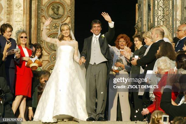 The young Ponti couple, Carlo Ponti and his Hungarian wife Andrea Meszaros wave to the crowd in front of the Basilaca in downtown Budapest 18...