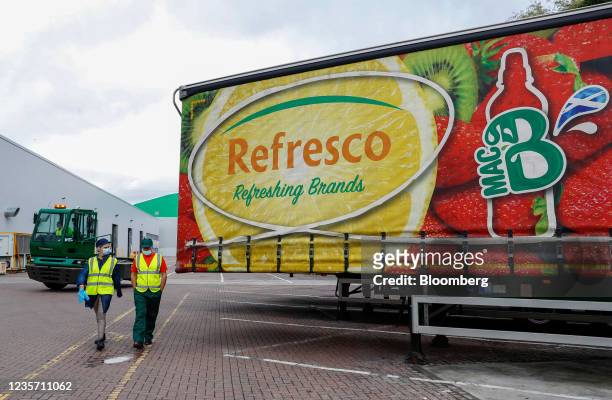 Worker prepares to move a truck trailer at the Refresco soft-drink bottling factory in Kegworth, U.K., on Tuesday, Oct. 5, 2021. PAI Partners is...