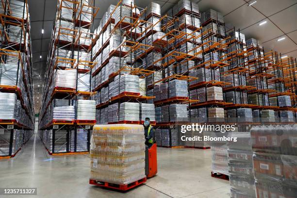 Worker moves a pallet of drinks at the Refresco soft-drink bottling factory in Kegworth, U.K., on Tuesday, Oct. 5, 2021. PAI Partners is considering...