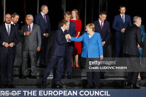 France's President Emmanuel Macron , Germany's Chancellor Angela Merkel , Eu members states and Western Balkans partners' representants pose as they...