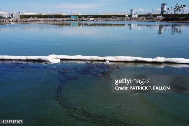 This aerial picture taken on October 5, 2021 shows oil containment booms placed by crews to contain oil that flowed near the Talbert Marsh and Santa...