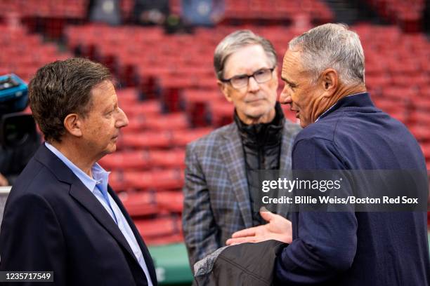 Major League Baseball Commissioner Rob Manfred speaks with Boston Red Sox Principal Owner John Henry and Chairman Tom Werner before the 2021 American...