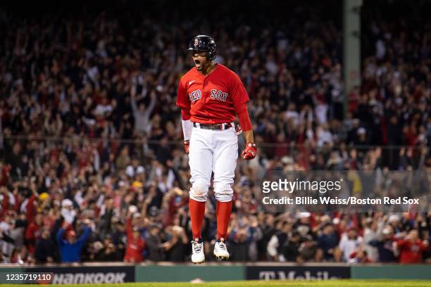 Xander Bogaerts of the Boston Red Sox reacts after hitting a two run home run during the first inning of the 2021 American League Wild Card game...