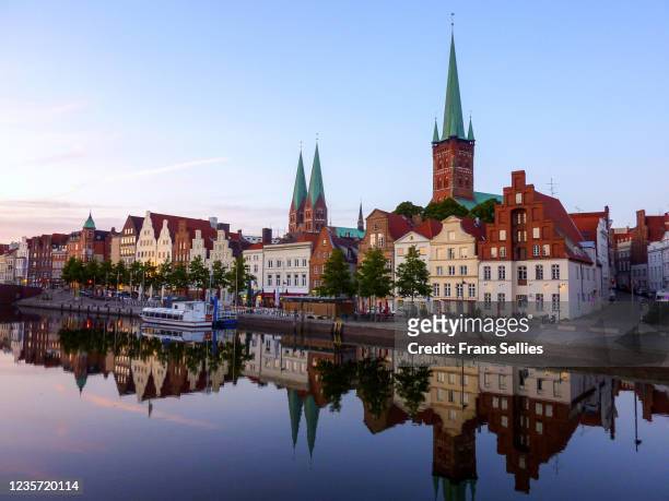 trave river and the historic centre of lübeck, germany - lübeck stock pictures, royalty-free photos & images