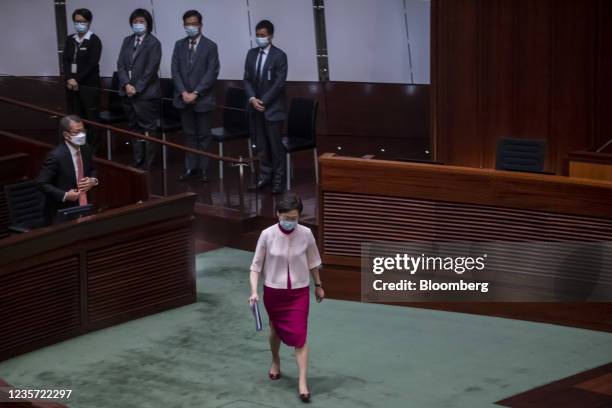 Carrie Lam, Hong Kong's chief executive, center, leaves after delivering her policy address at the Legislative Council in Hong Kong, China, on...