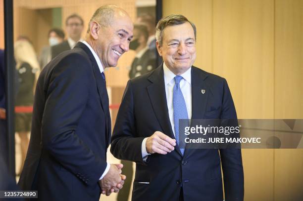 Slovenia's Prime Minister Janez Jansa welcomes Italy's Prime Minister Mario Draghi for the EU-Western Balkans summit at Brdo Congress Centre, near...
