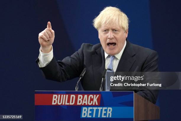 Britain's Prime Minister Boris Johnson delivers his keynote leader's speech during the Conservative Party conference at Manchester Central Convention...