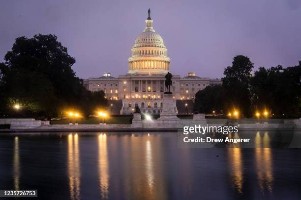 View of the U.S. Capitol at dawn on Wednesday morning October 6, 2021 in Washington, DC. Senate Majority Leader Chuck Schumer will try again on...