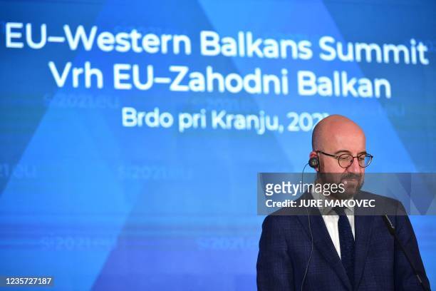 European Council President Charles Michel listens to a speech as he attends a press conference at the end of the EU-Western Balkans summit in Brdo...