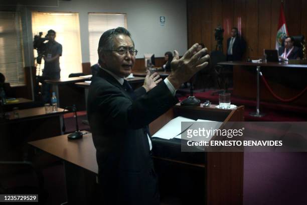 Former Peruvian president Alberto Fujimori, who is on trial for allegedly authorizing two army death squad massacres, speaks during the hearing in...