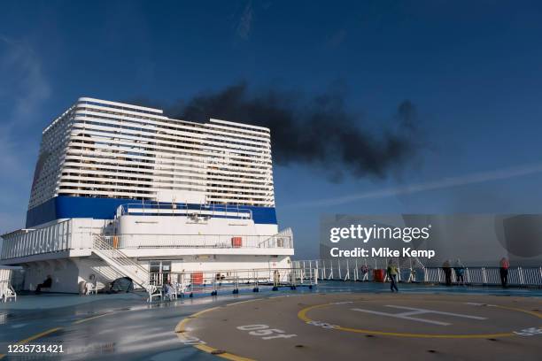 Diesel smoke pours from the funnels of Brittany Ferries roll-on / roll-off car ferry as the engines start up prior to departure on 26th September...