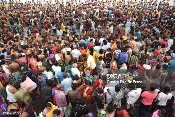 Hindu devotees take part in the Tarpan ritual during Mahalaya prayers amidst Covid-19 pandemic on the banks of the holy river Ganga in Kolkata.