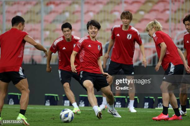 Japan's players attend a training session at King Abdullah Sport City Stadium in Jeddah on October 6 ahead of a FIFA World Cup Qatar 2022 qualifier...