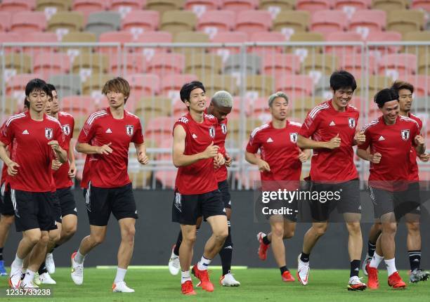 Japan's players attend a training session at King Abdullah Sport City Stadium in Jeddah on October 6 ahead of a FIFA World Cup Qatar 2022 qualifier...