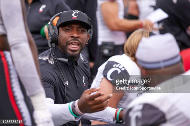 Cincinnati Bearcats defensive line coach Greg Scruggs talks to his players during a game between the Notre Dame Fighting Irish and the Cincinnati...