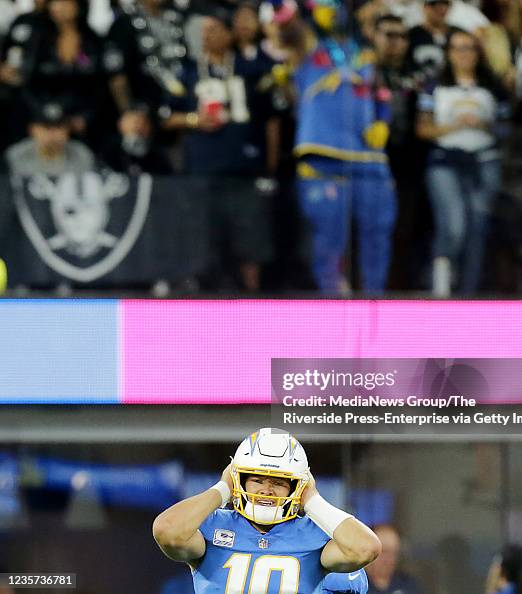 Los Angeles Chargers quarterback Justin Herbert tries to listen to